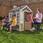 Casuta de joaca Cuptorul cu Lemne Kidkraft Cozy Hearth - Casa cu LEDuri pentru copii cu pridvor si bancute cu bucatarie si accesorii Cabin PlayHouse